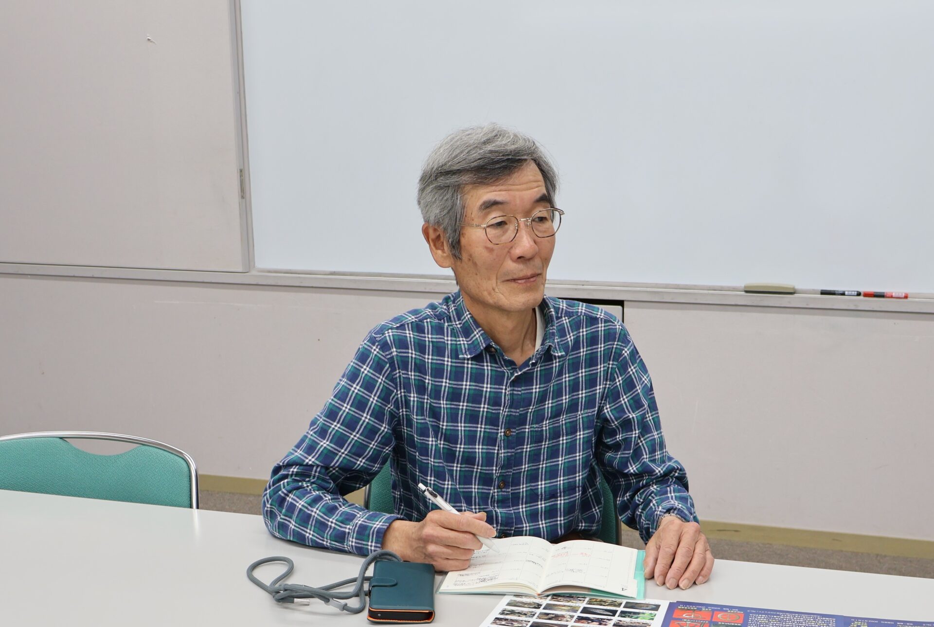 取材を受ける田賀辰也さん