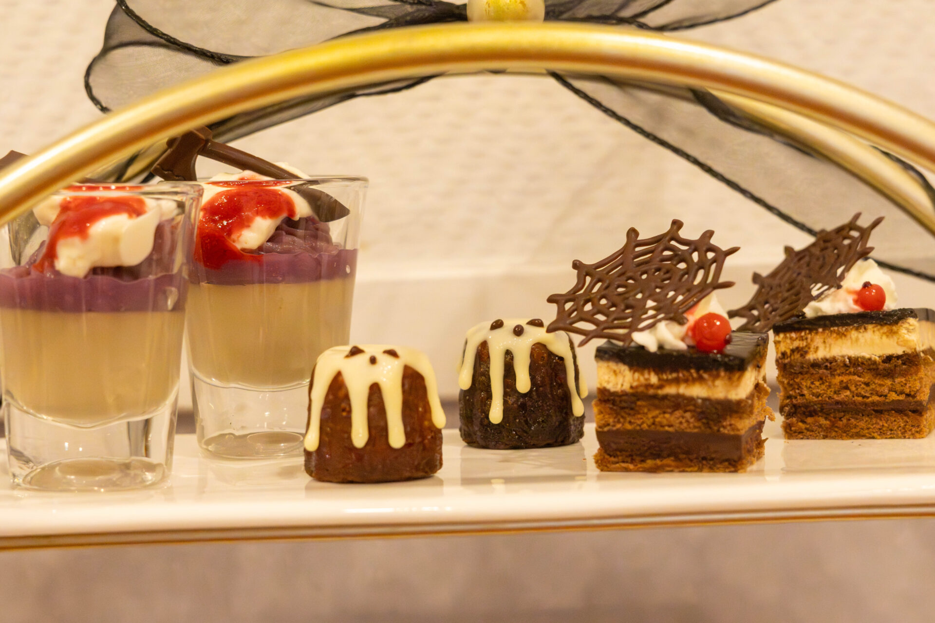 From left: Hojicha and Purple Sweet Potato Bavarois, White Chocolate Canelé, Redcurrant Chocolate Cake